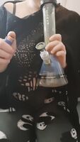 Big bong toke for Ginger before revealing pale tits
