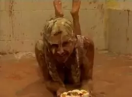 Rubbing some dessert in her own face