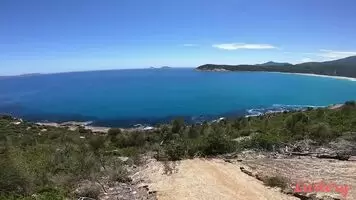 Making love by a beautiful landscape.