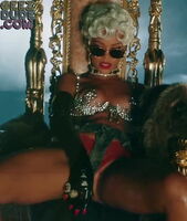 Rihanna in underwear with her legs spread wide and lots of cleavage - looped