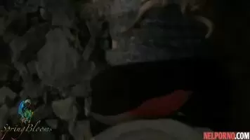 A girl in nature lifts up her black skirt and flashes her tight ass in red panties