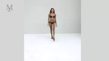 Long-haired brunette in black bikini