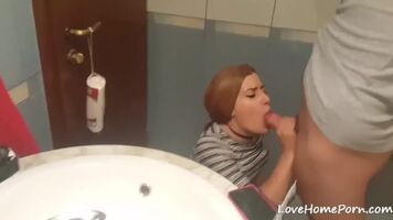 Redhead receives an unexpected facial in the bathroom