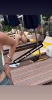 Woman taking a selfie of her ass in public.