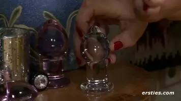 Showing off her glass.