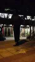 undress next to a bike at night