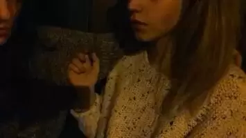 Kiss on a bench in a cold night. Blonde girl is blushing. So hot.