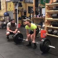 Man uses retard strength to dead lift double hit body weight.