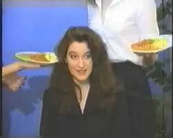 Smearing her with multiple plates of food