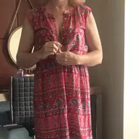 Starting to undress.