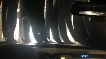 Getting dirty while the car gets clean