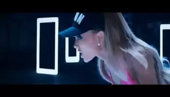 Ariana Grande gets it from behind
